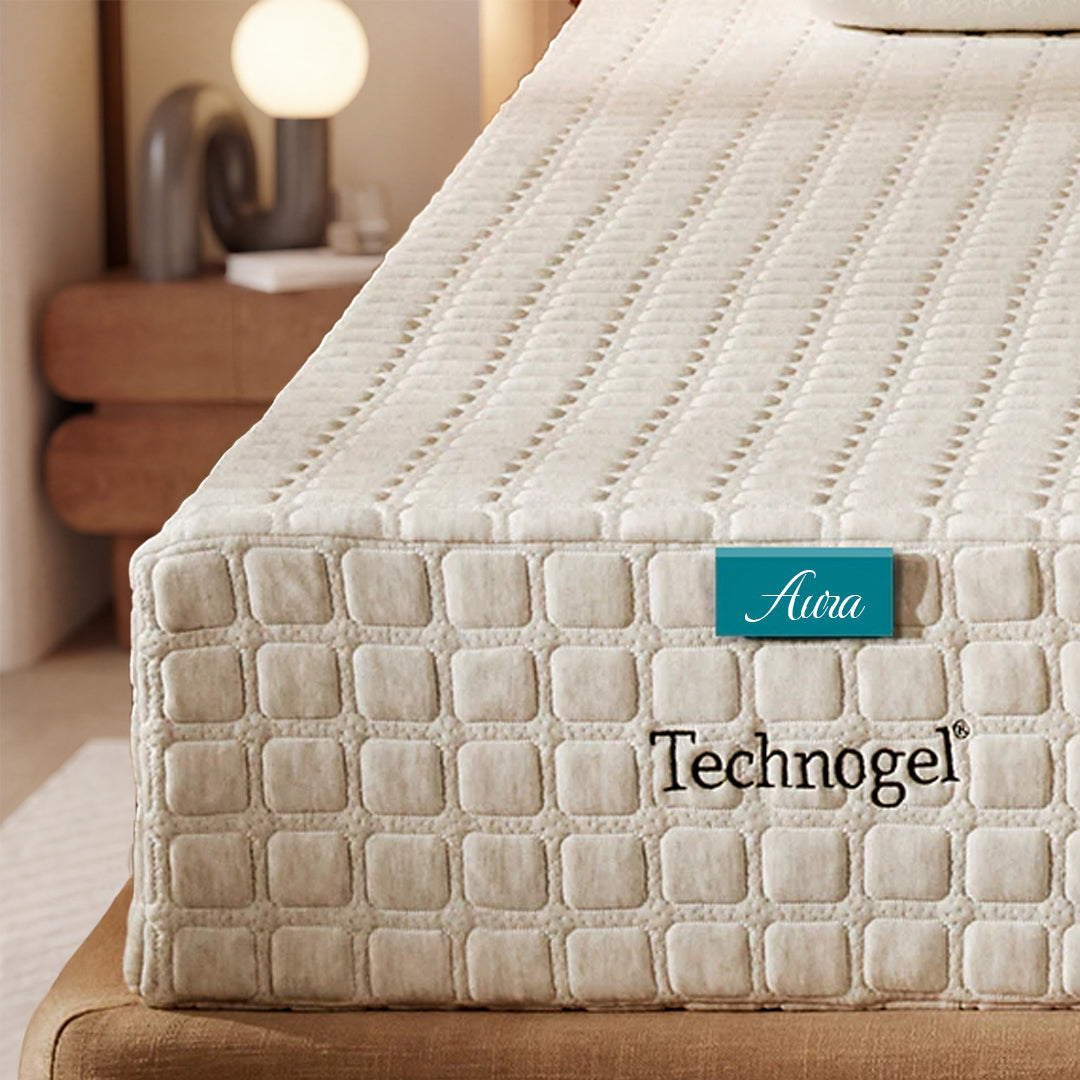 Technogel mattress with 'Aura' label in a bedroom setting