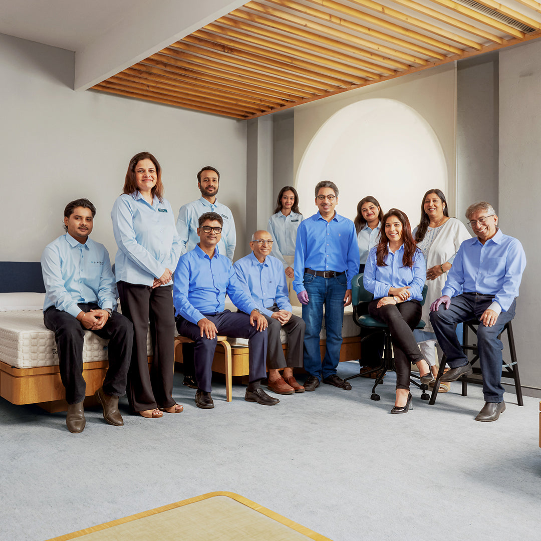 Group of people posing for a photo in a modern interior setting
