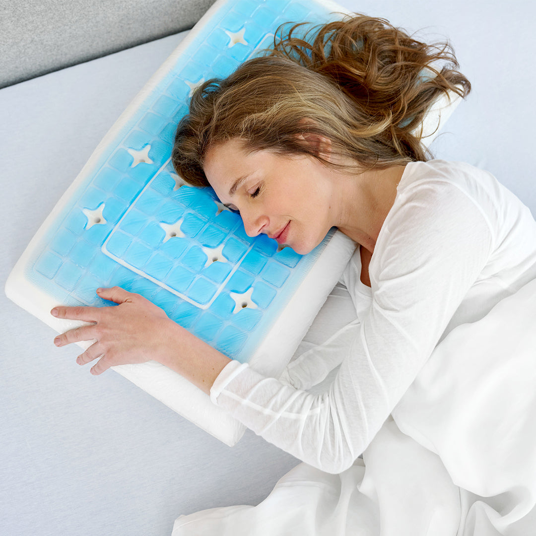 Woman lying on a blue and white pillow with star patterns