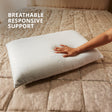 White pillow on a beige bed with text 'Breathable Responsive Support'.