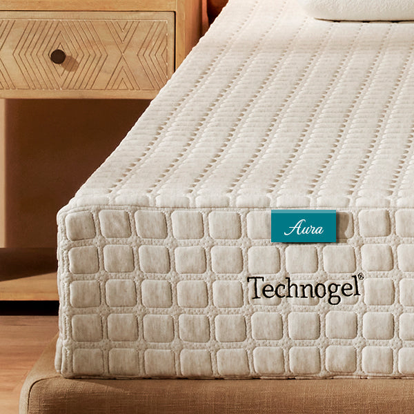 Technogel mattress with 'Aura' label on a bed