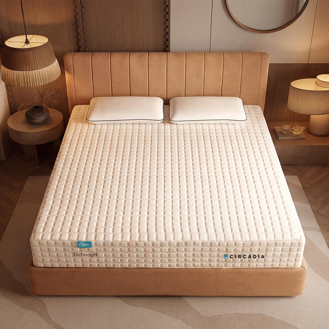 Beige mattress on a bed with a headboard in a bedroom setting