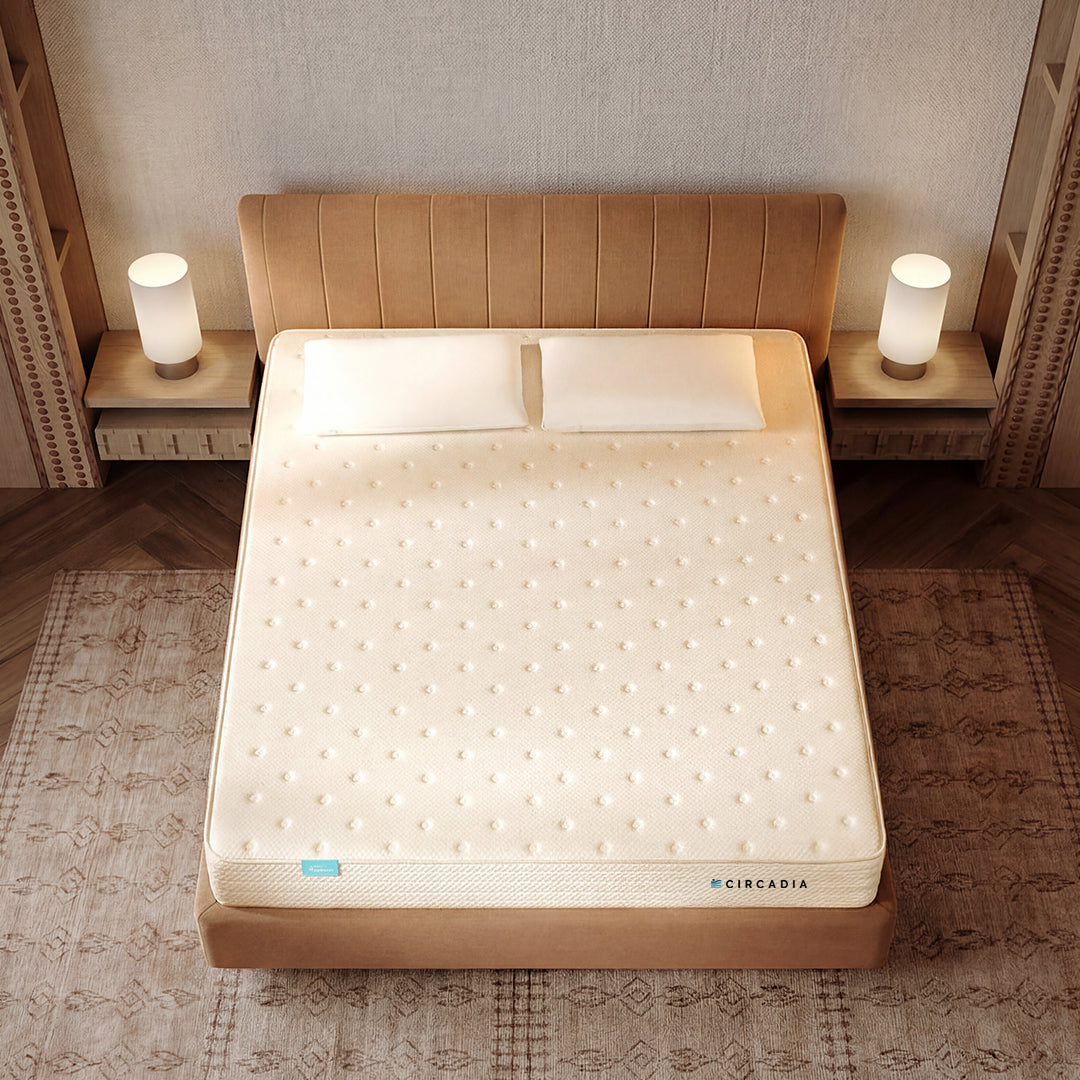 Beige mattress on a bed with 'Circadia' branding in a bedroom setting.
