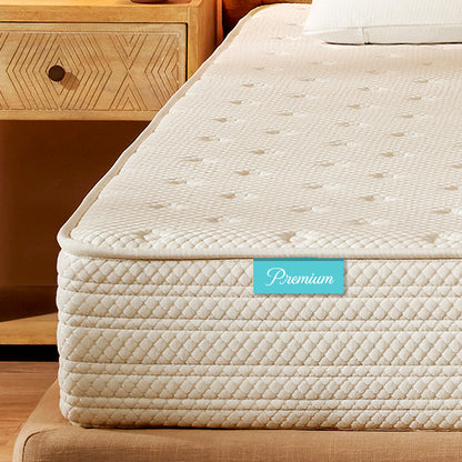 Beige mattress with a 'Premium' label on a wooden bed frame.
