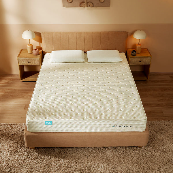 Beige mattress on a bed with 'Circadia' branding in a bedroom setting.