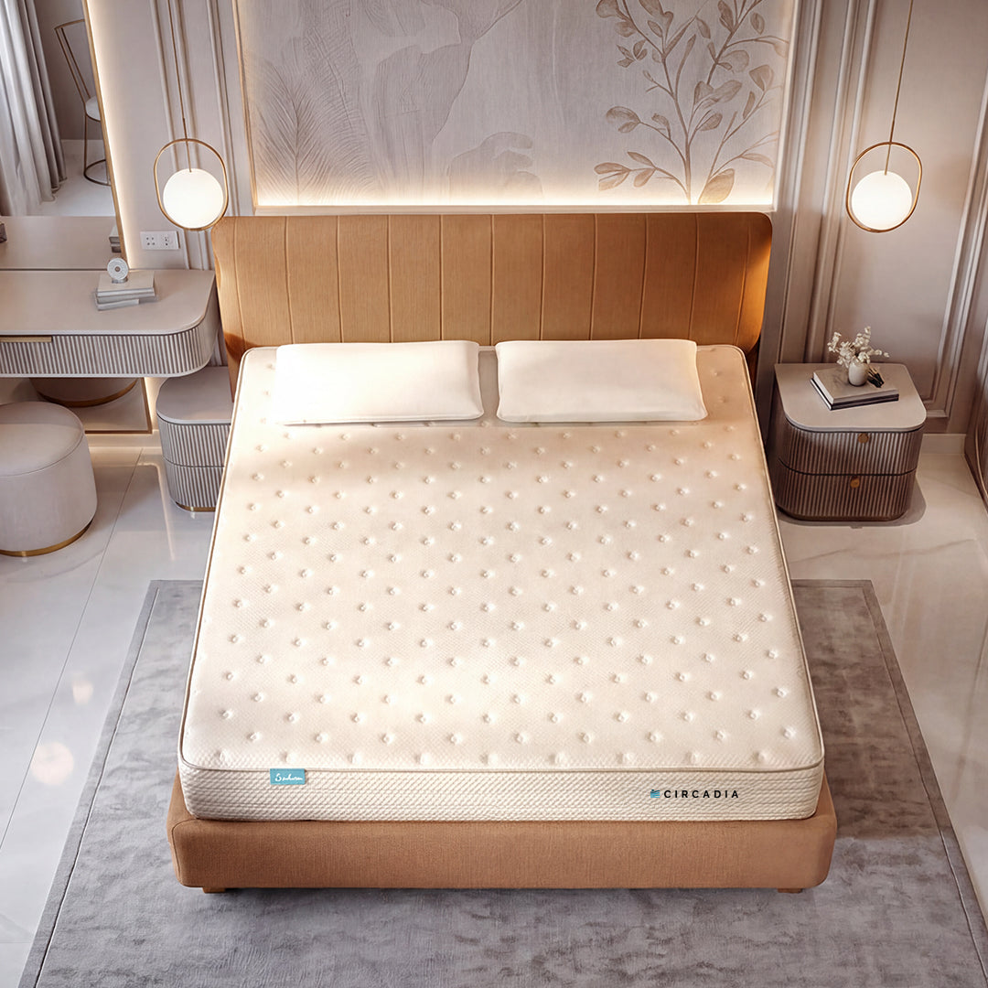 Mattress on a bed in a modern bedroom setting with Circadia branding.