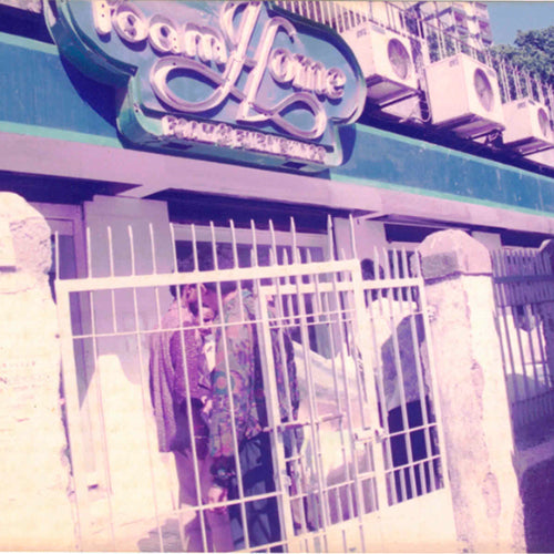 Storefront with a sign reading 'Home' and decorative elements.
